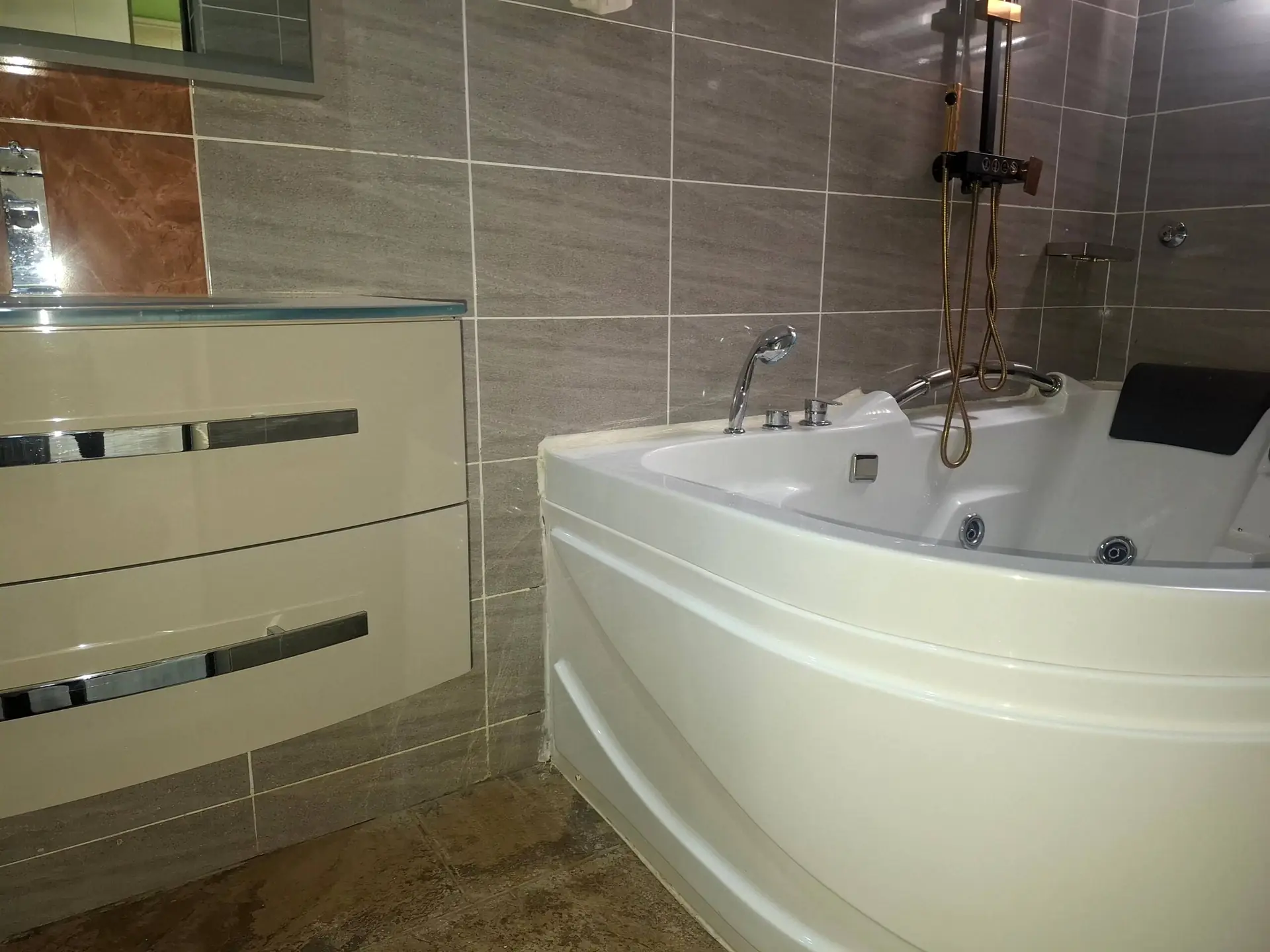 A VVIP bathroom with a corner bathtub