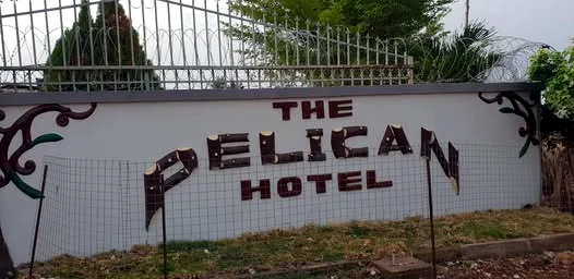 The Pelican Hotel sign on the front wall